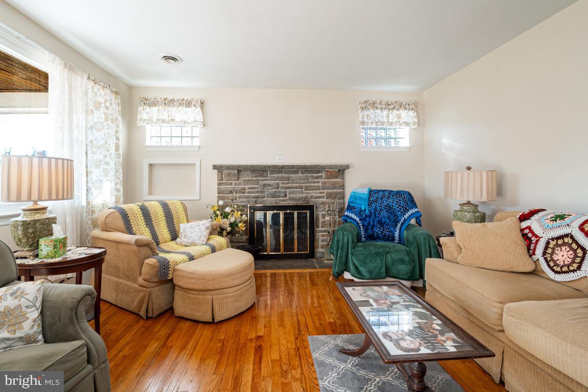 8504 Bassett Road Baltimore, MD 21237 - Photo 7 of 35 a living room with furniture and a fireplace