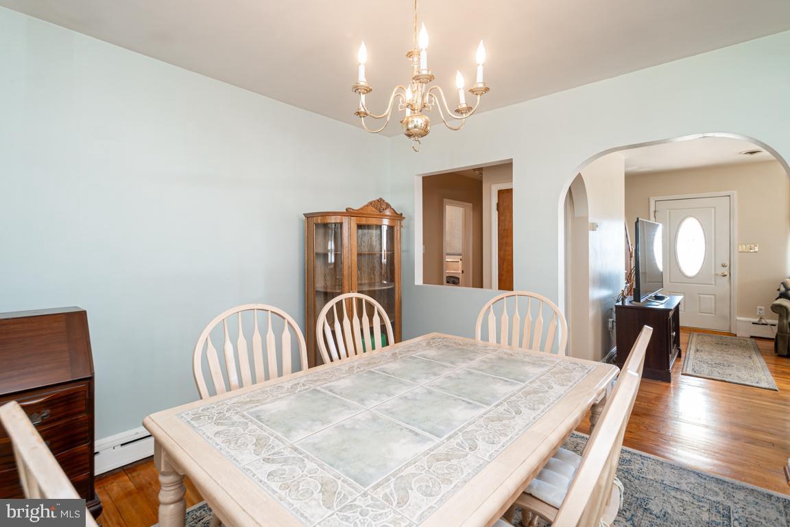 8504 Bassett Road Baltimore, MD 21237 - Photo 10 of 35 a view of a dining room with furniture and wooden floor