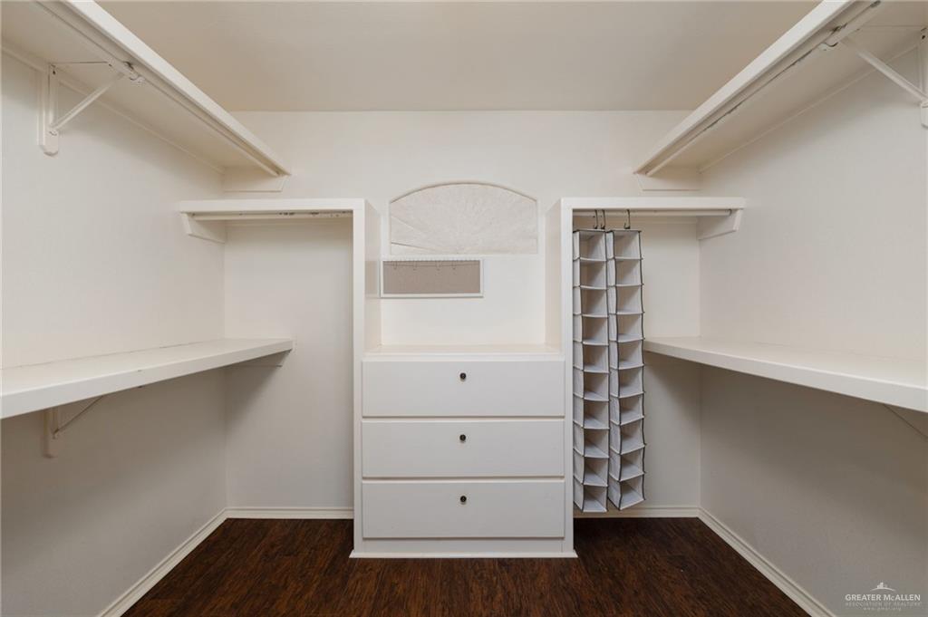 2111 East 25th Street Mission, TX 78574 - Photo 11 of 19 a view of walk in closet with empty racks