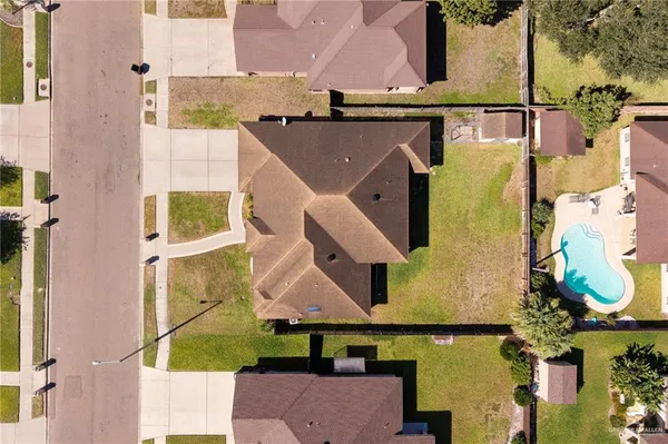 an aerial view of residential houses with outdoor space