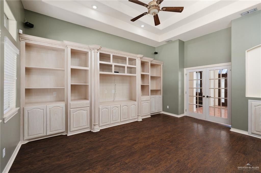 2111 East 25th Street Mission, TX 78574 - Photo 5 of 19 a view of an empty room with wooden floor and a window