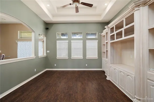a view of room with window and wooden floor