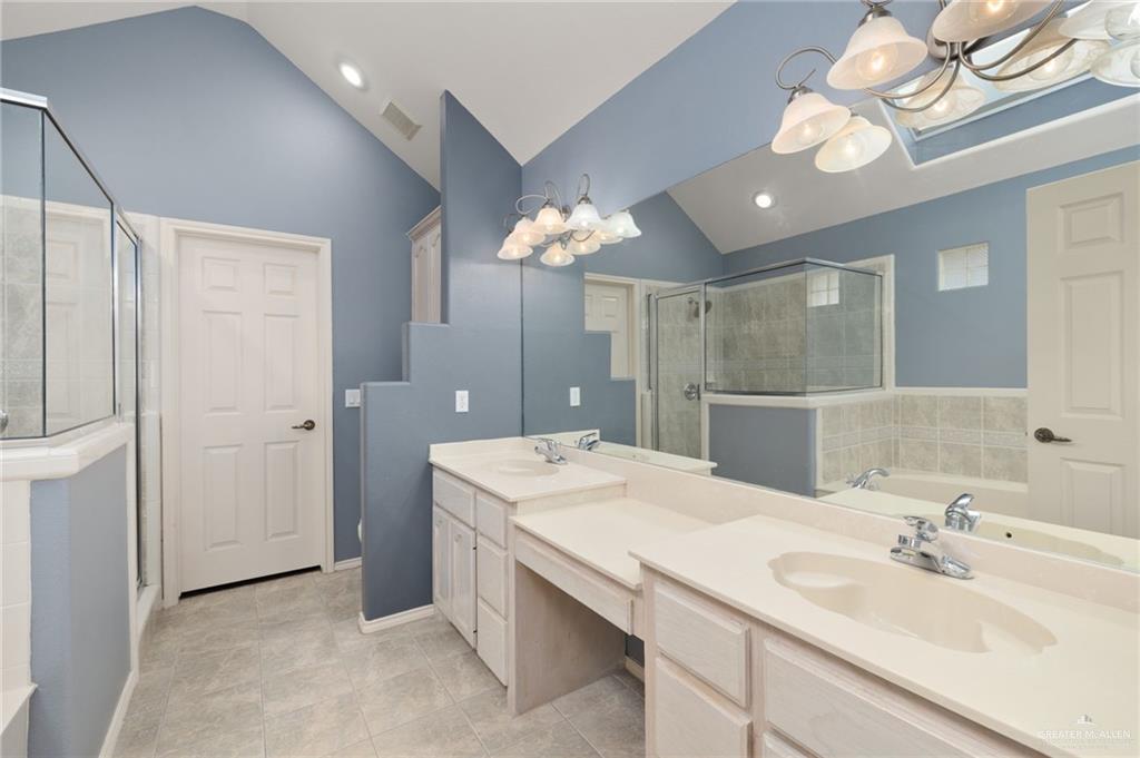 2111 East 25th Street Mission, TX 78574 - Photo 10 of 19 a bathroom with a double vanity sink mirror and