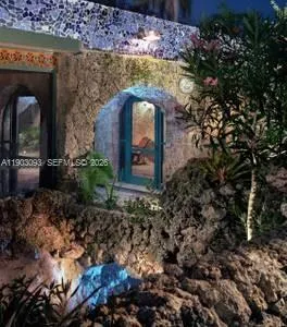 a view of a house with a yard and tree s