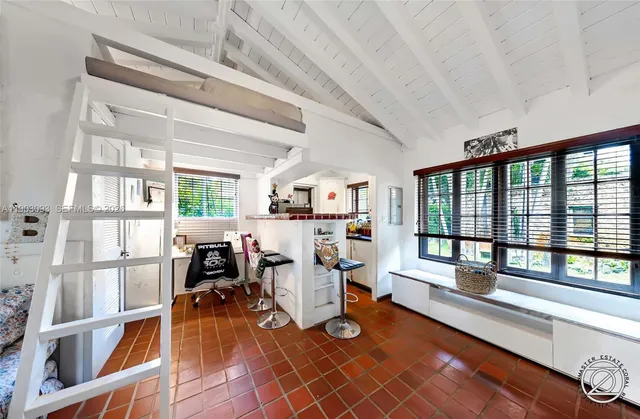 a bathroom with a toilet a sink and a window