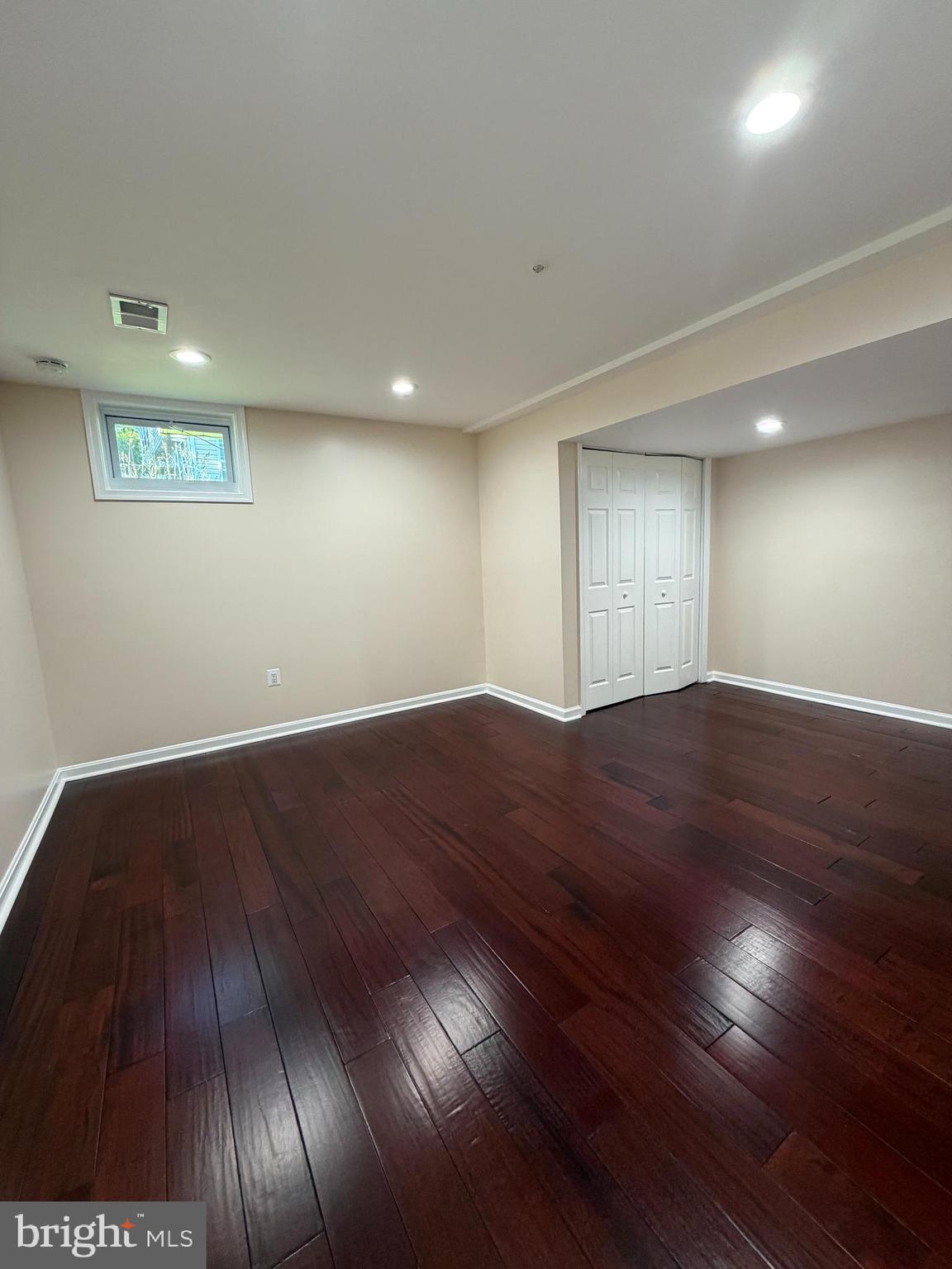 13952 Bishops Bequest Road Upper Marlboro, MD 20772 - Photo 20 of 28 an empty room with wooden floor