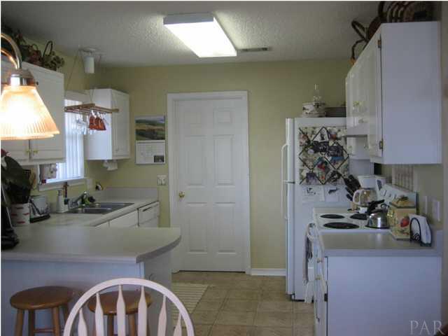 5861 Admirals Road Milton, FL 32583 - Photo 4 of 24 This kitchen is a perfect size for your family.
