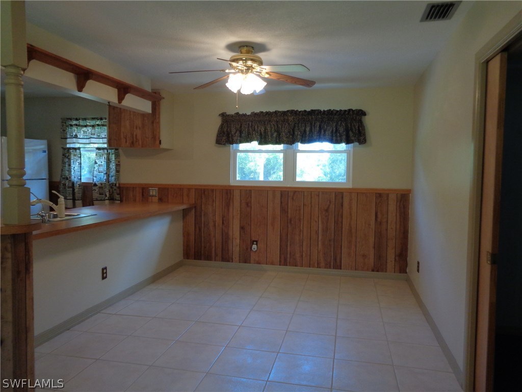 5458 Judith Road Bokeelia, FL 33922 - Photo 12 of 25 a spacious bathroom with a double vanity sink and a mirror