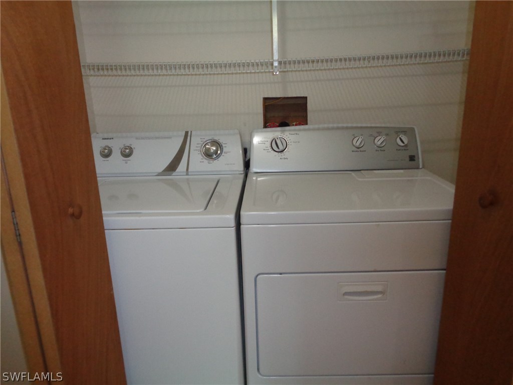 5458 Judith Road Bokeelia, FL 33922 - Photo 14 of 25 a utility room with dryer and washer