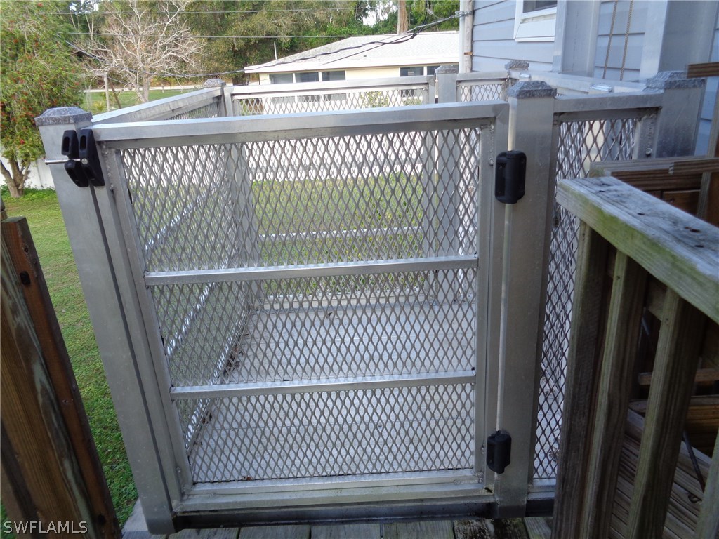 5458 Judith Road Bokeelia, FL 33922 - Photo 15 of 25 a view of a balcony with wooden floor