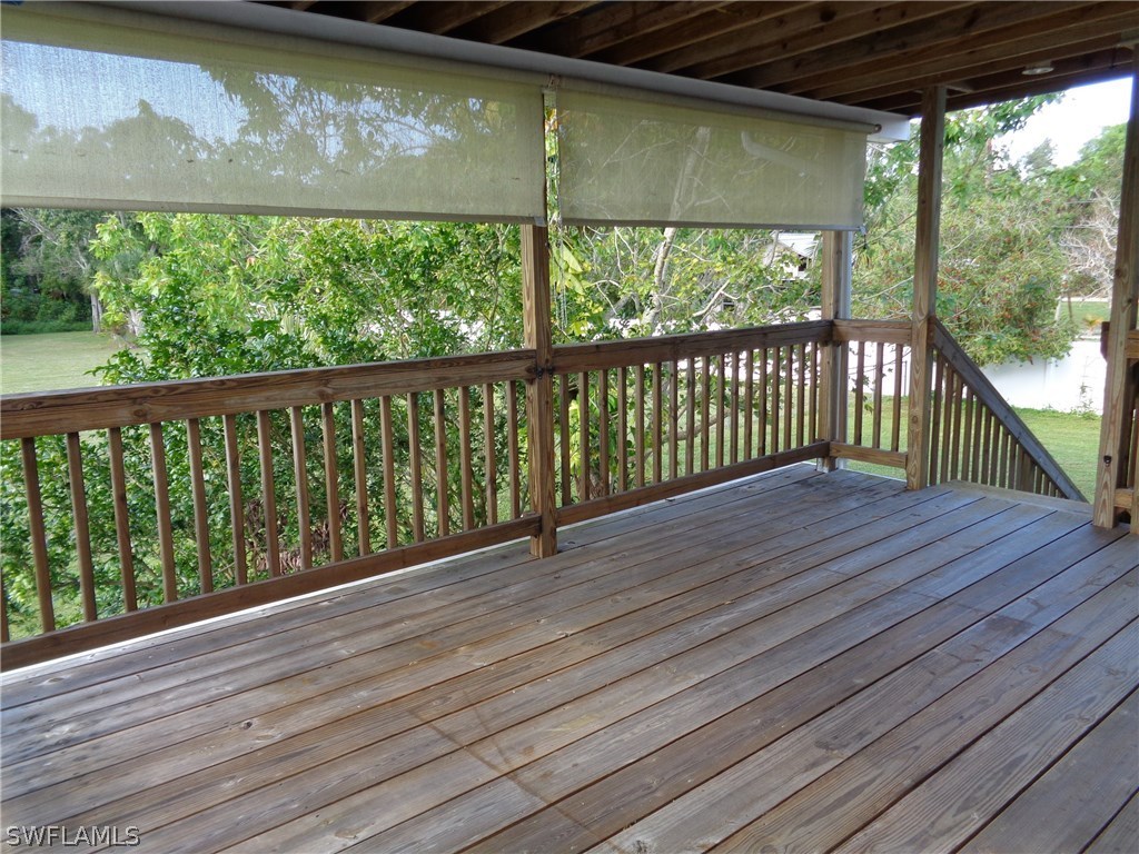 5458 Judith Road Bokeelia, FL 33922 - Photo 16 of 25 a view of a balcony with wooden floor