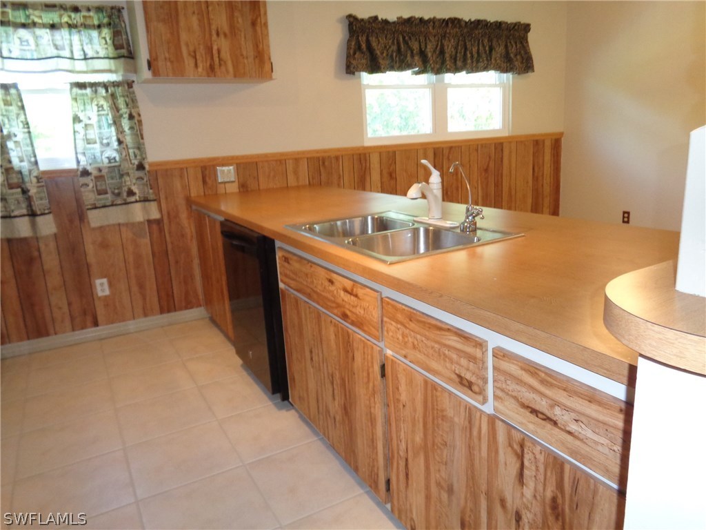 5458 Judith Road Bokeelia, FL 33922 - Photo 2 of 25 a kitchen with a sink and a window