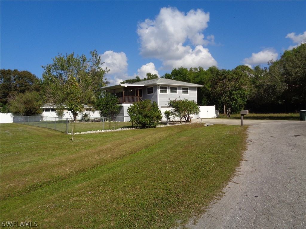 5458 Judith Road Bokeelia, FL 33922 - Photo 24 of 25 a front view of a house with garden