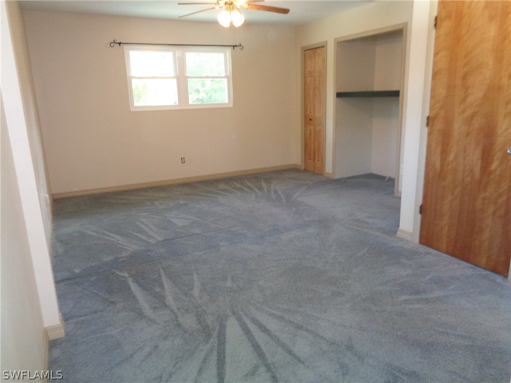 5458 Judith Road Bokeelia, FL 33922 - Photo 5 of 25 an empty room with a window