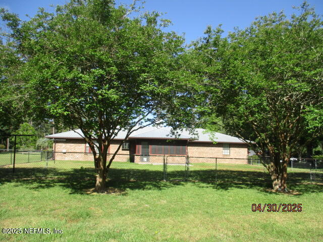 11375 Pine Loop Glen St. Mary, FL 32040 - Photo 26 of 33 a view of house with a big yard