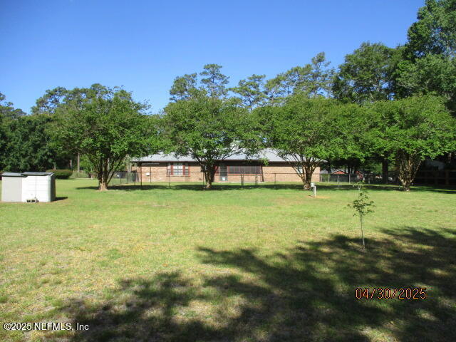 11375 Pine Loop Glen St. Mary, FL 32040 - Photo 31 of 33 a view of a house with a yard