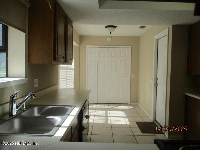 11375 Pine Loop Glen St. Mary, FL 32040 - Photo 6 of 33 a kitchen with granite countertop a sink and a stove top oven