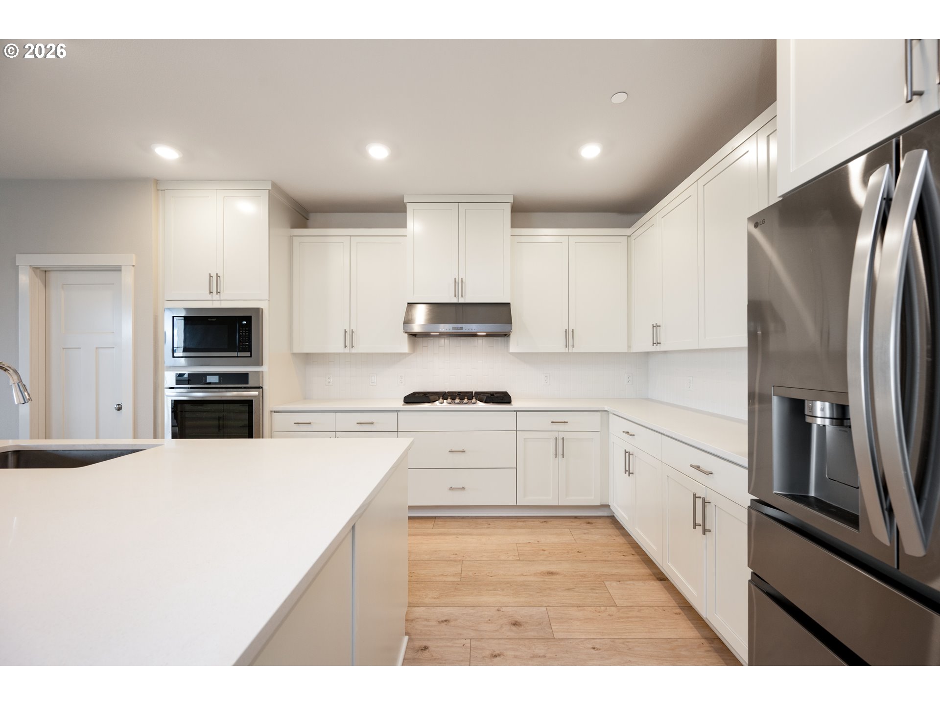 16800 Southwest Dowitcher Lane Beaverton, OR 97007 - Photo 11 of 48 a kitchen with stainless steel appliances cabinets a sink and a stove
