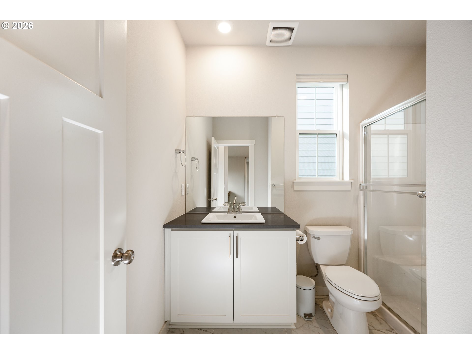 16800 Southwest Dowitcher Lane Beaverton, OR 97007 - Photo 17 of 48 a bathroom with a toilet a sink and a window