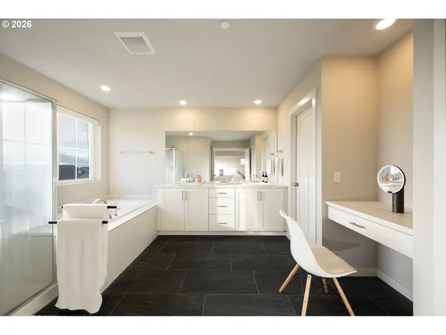 a view of kitchen with a sink dishwasher a dining table chairs with wooden floor