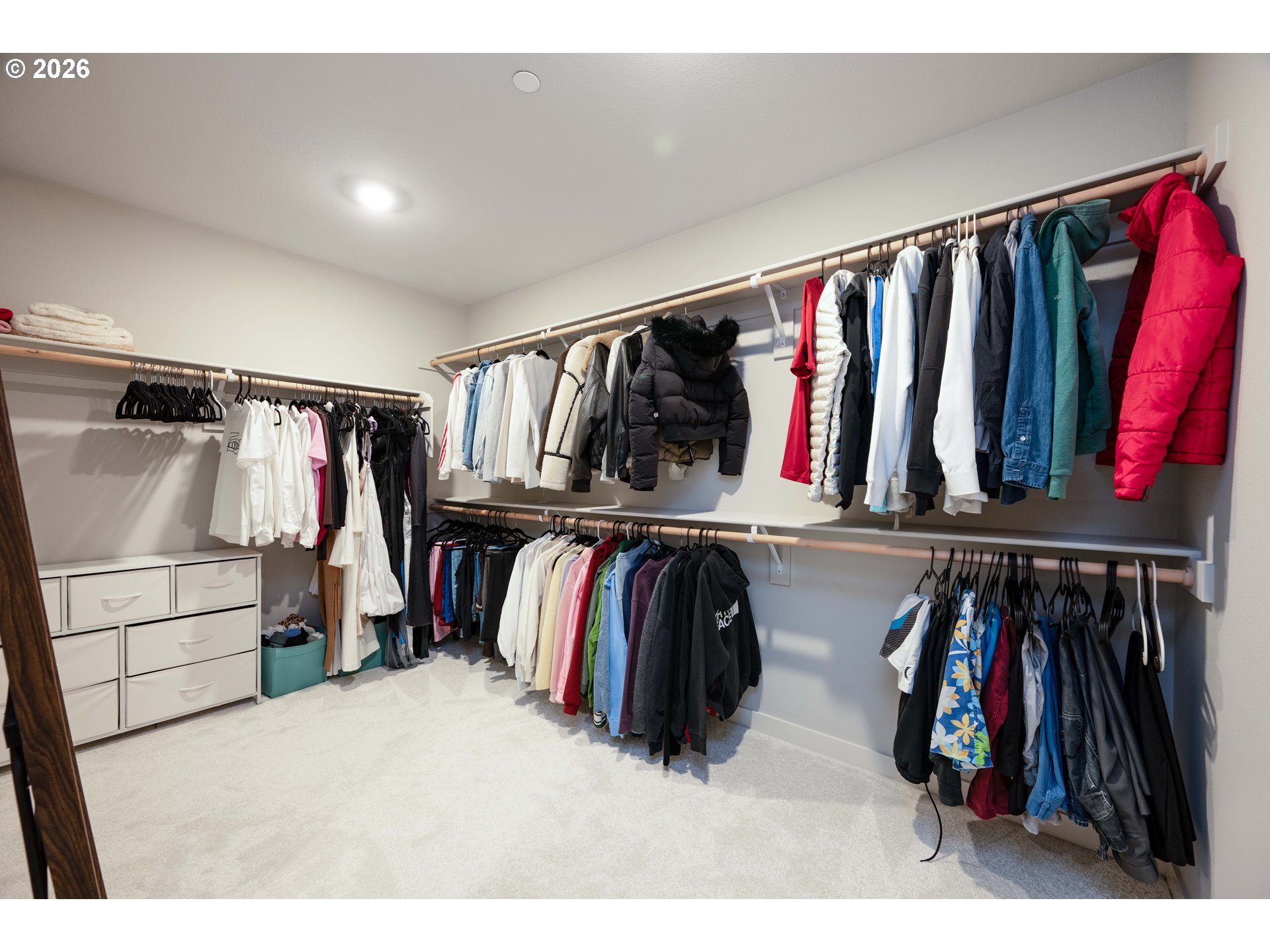 16800 Southwest Dowitcher Lane Beaverton, OR 97007 - Photo 28 of 48 a view of walk in closet with clothes and shoes