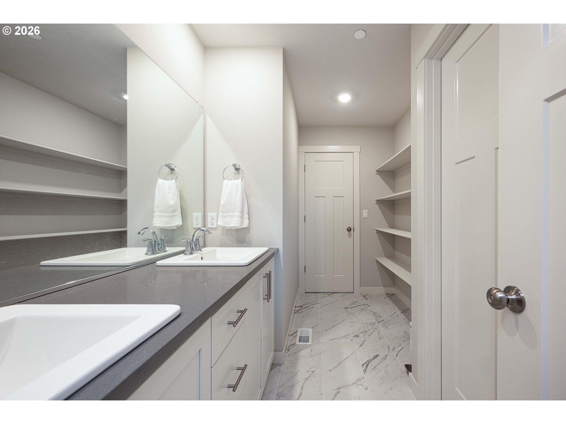 16800 Southwest Dowitcher Lane Beaverton, OR 97007 - Photo 33 of 48 a bathroom with a double vanity sink a mirror and a shower