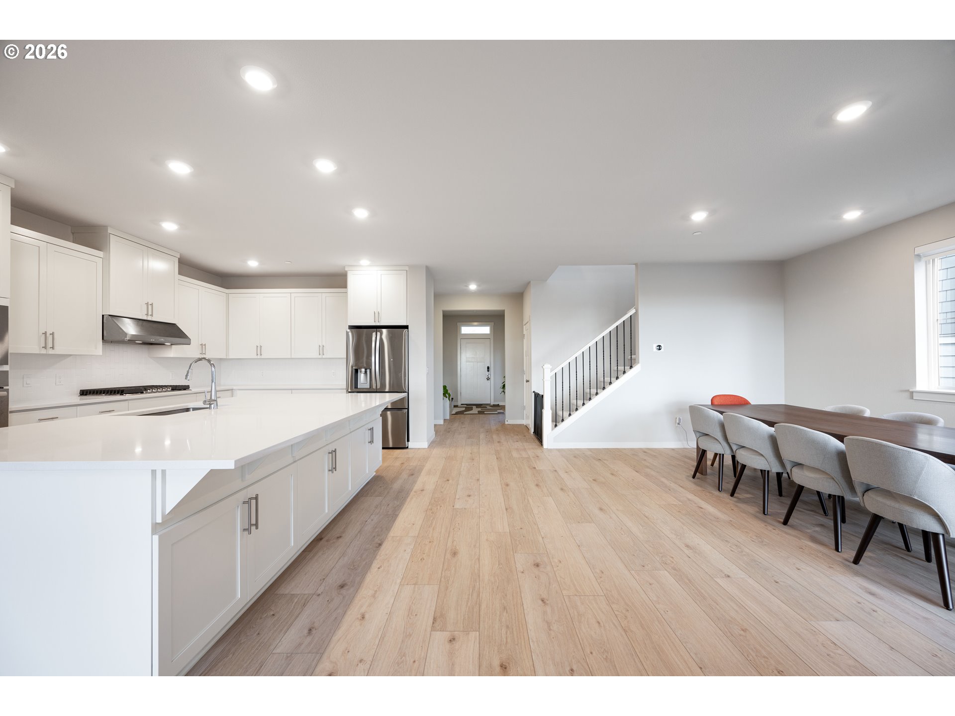 16800 Southwest Dowitcher Lane Beaverton, OR 97007 - Photo 9 of 48 a large white kitchen with lots of counter space