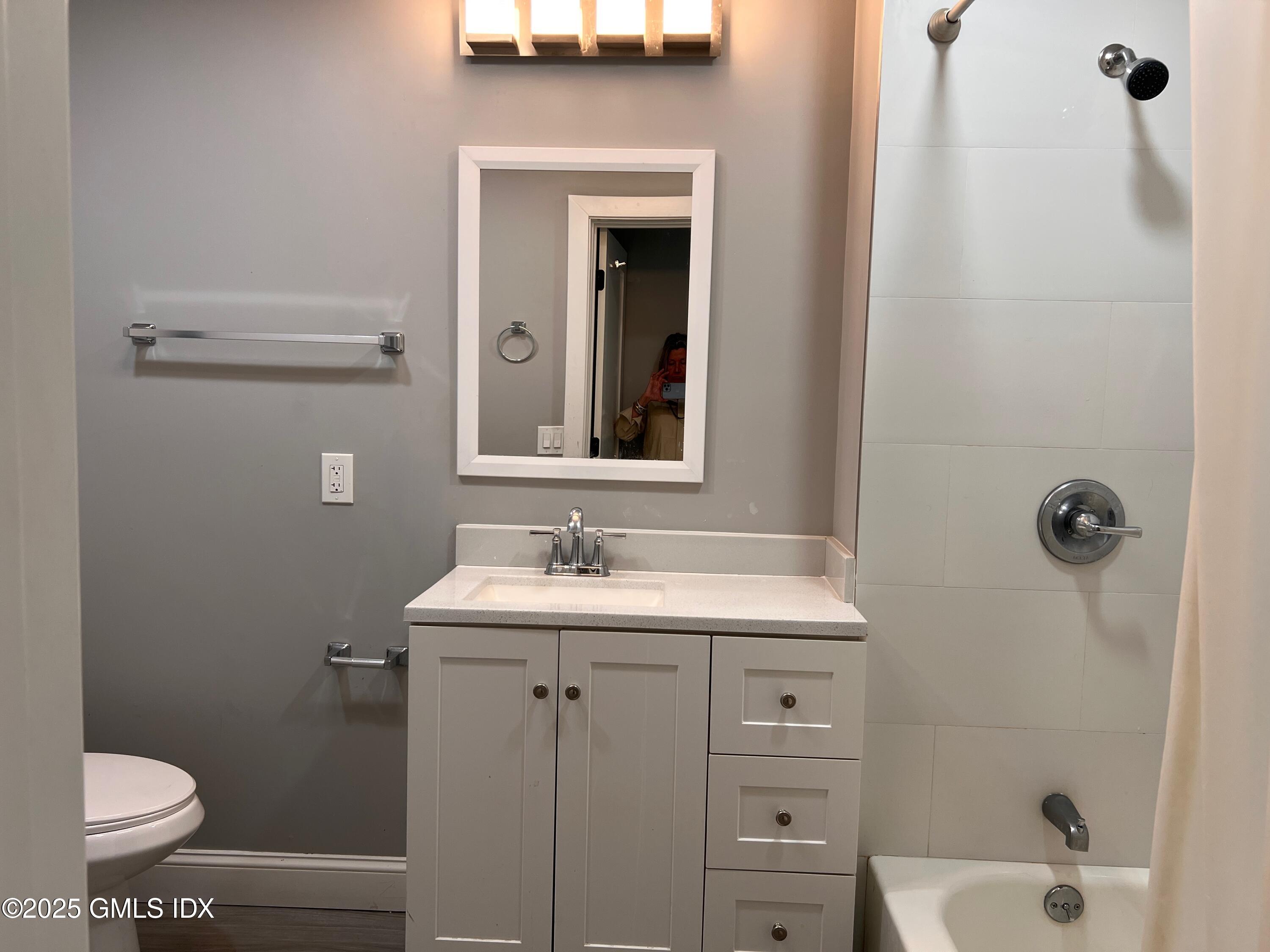 15 Beech Street, Unit 2N Greenwich, CT 06830 - Photo 14 of 15 a bathroom with a sink a toilet and shower