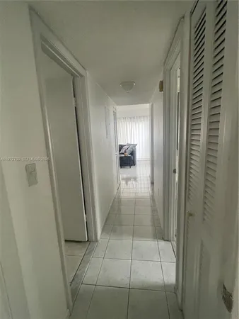 a bathroom with a glass door shower