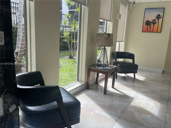 a living room with furniture and a chair