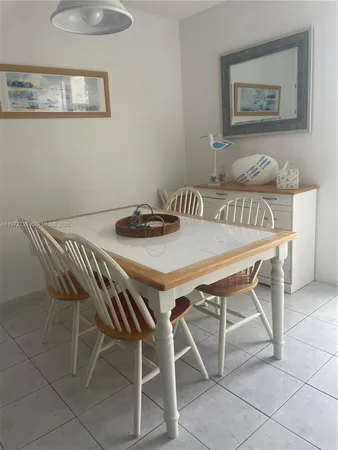 a dinning table and chair in a room