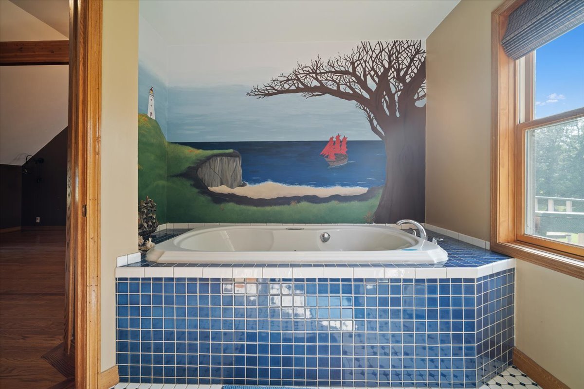 24403 North 750 E Road Pontiac, IL 61764 - Photo 36 of 54 a bathroom with a bathtub and a shower