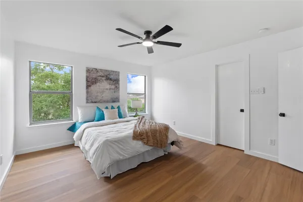 a bedroom with a bed and window