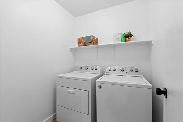 a utility room with dryer and washer