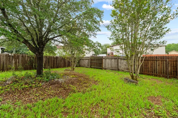 a view of backyard with green space