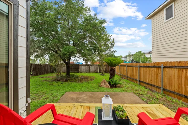 a view of yard with patio