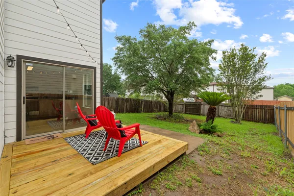 a view of a backyard with sitting area
