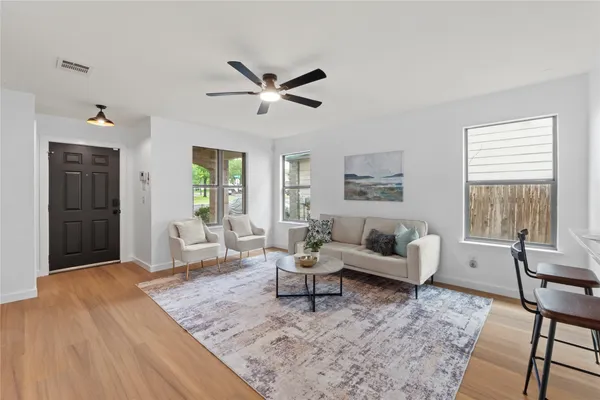 a living room with furniture and a large window