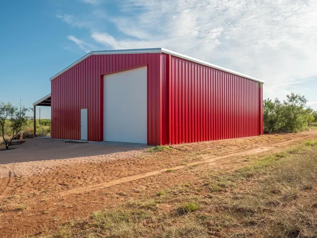 a view of a house with backyard and bushes
