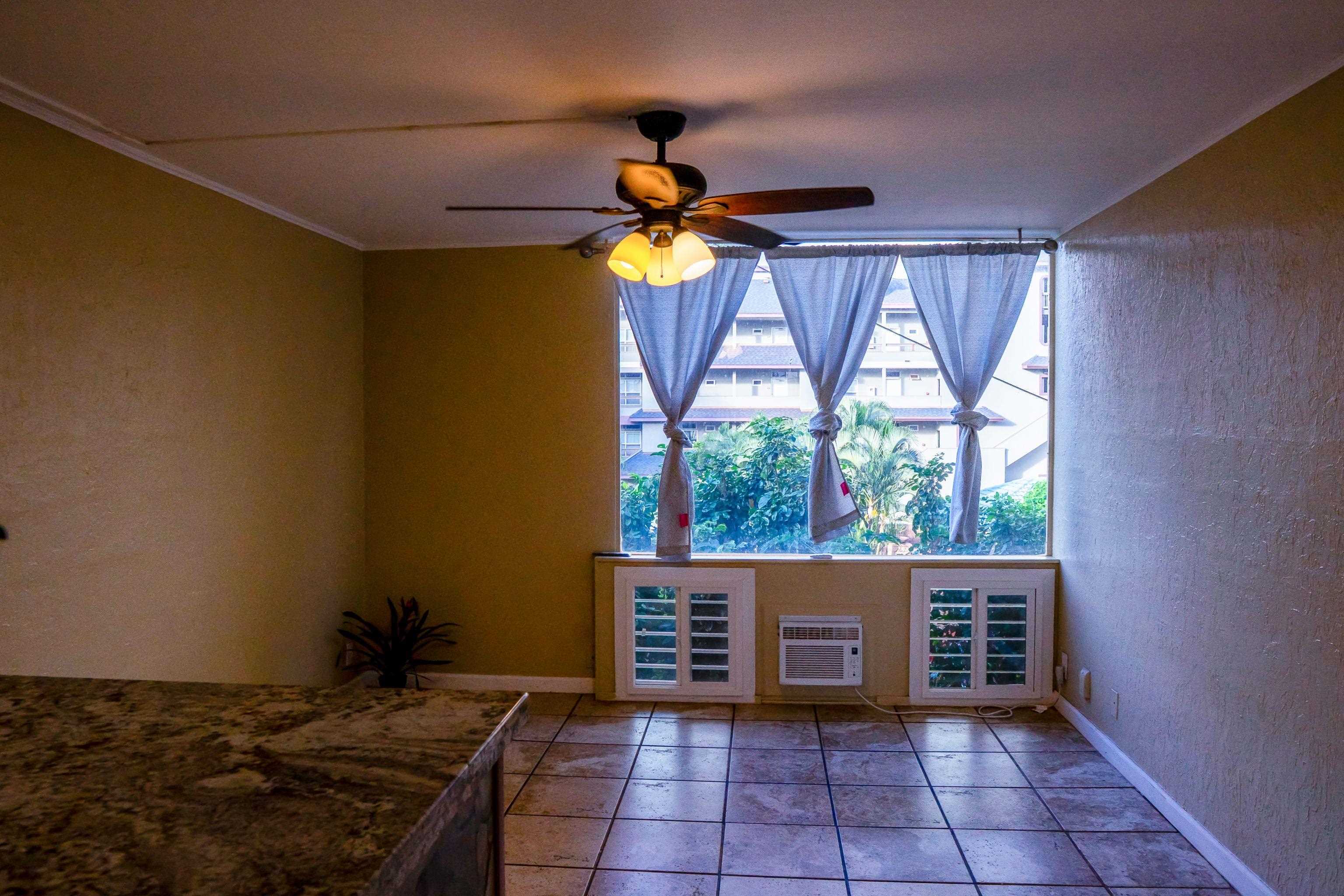 3676 Lower Honoapiilani Road, Unit C301 Lahaina, HI 96761 - Photo 17 of 49 a bedroom with a bed and a window