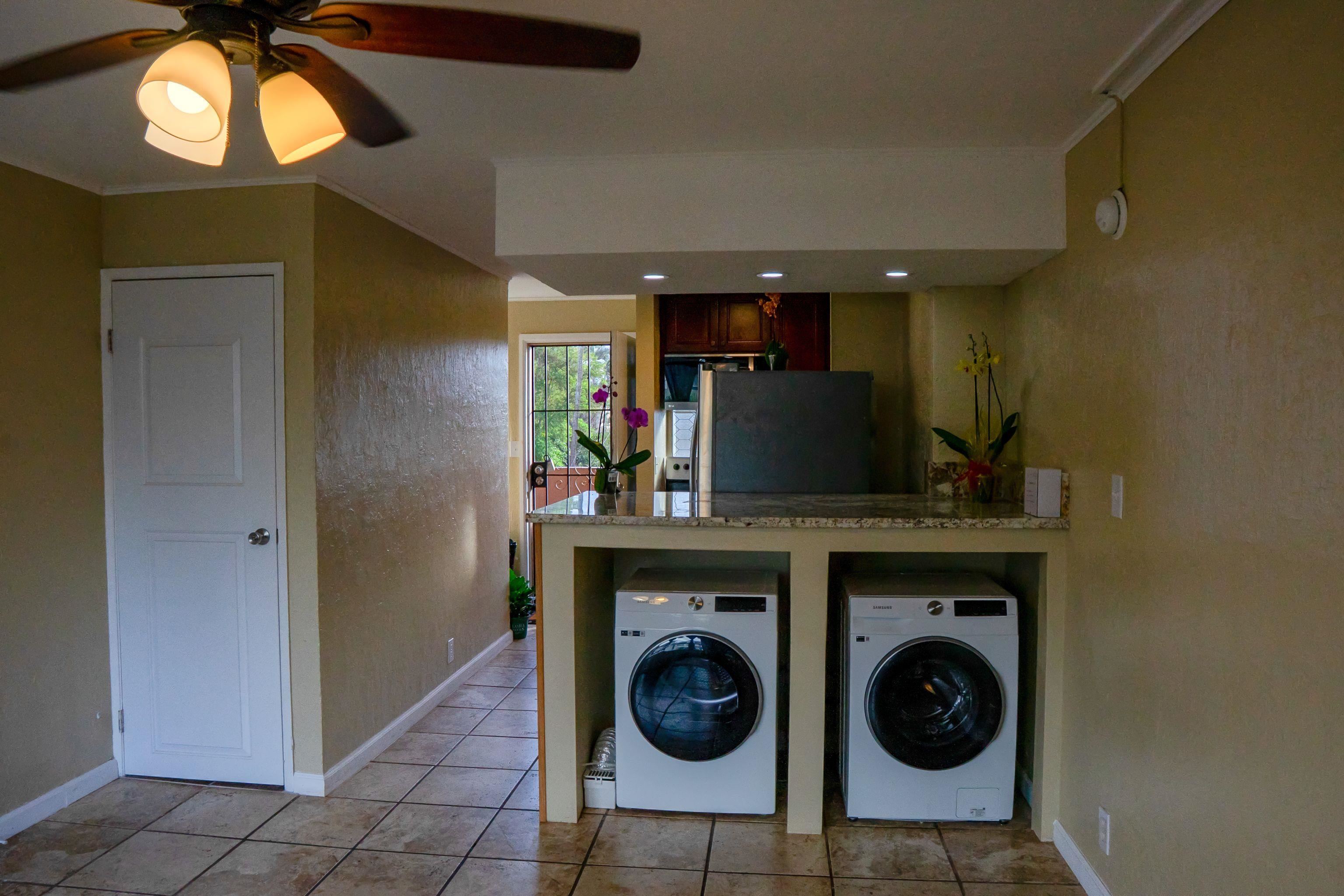 3676 Lower Honoapiilani Road, Unit C301 Lahaina, HI 96761 - Photo 19 of 49 a view of a hallway with washer and dryer