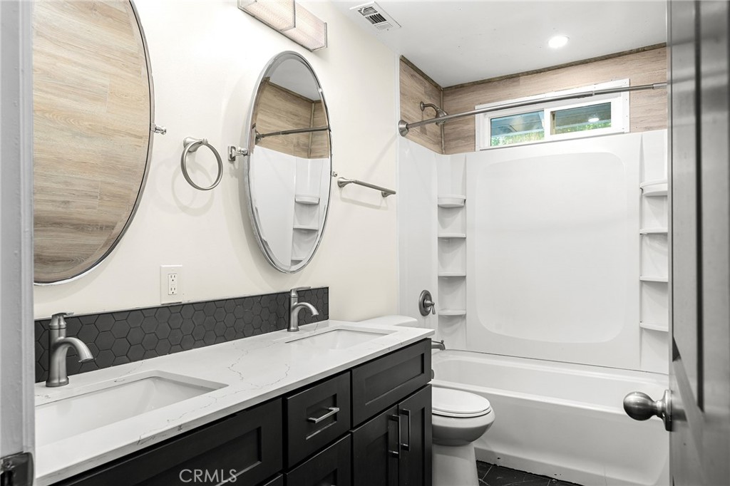 1131 Stewart Avenue Chico, CA 95926 - Photo 17 of 51 a bathroom with a sink a toilet and a mirror