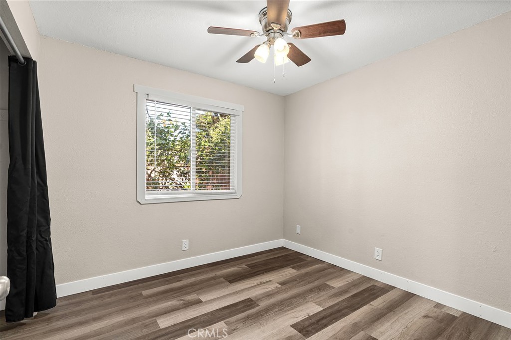 1131 Stewart Avenue Chico, CA 95926 - Photo 18 of 51 a view of empty room with wooden floor and fan