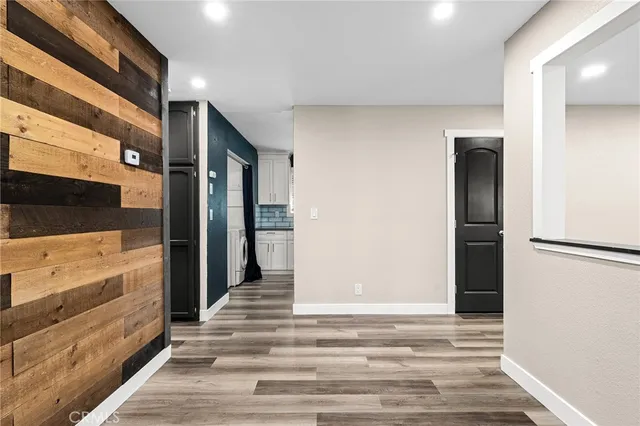 a kitchen with a sink and white cabinets