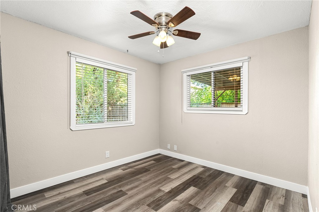 1131 Stewart Avenue Chico, CA 95926 - Photo 21 of 51 a view of an empty room with window and wooden floor