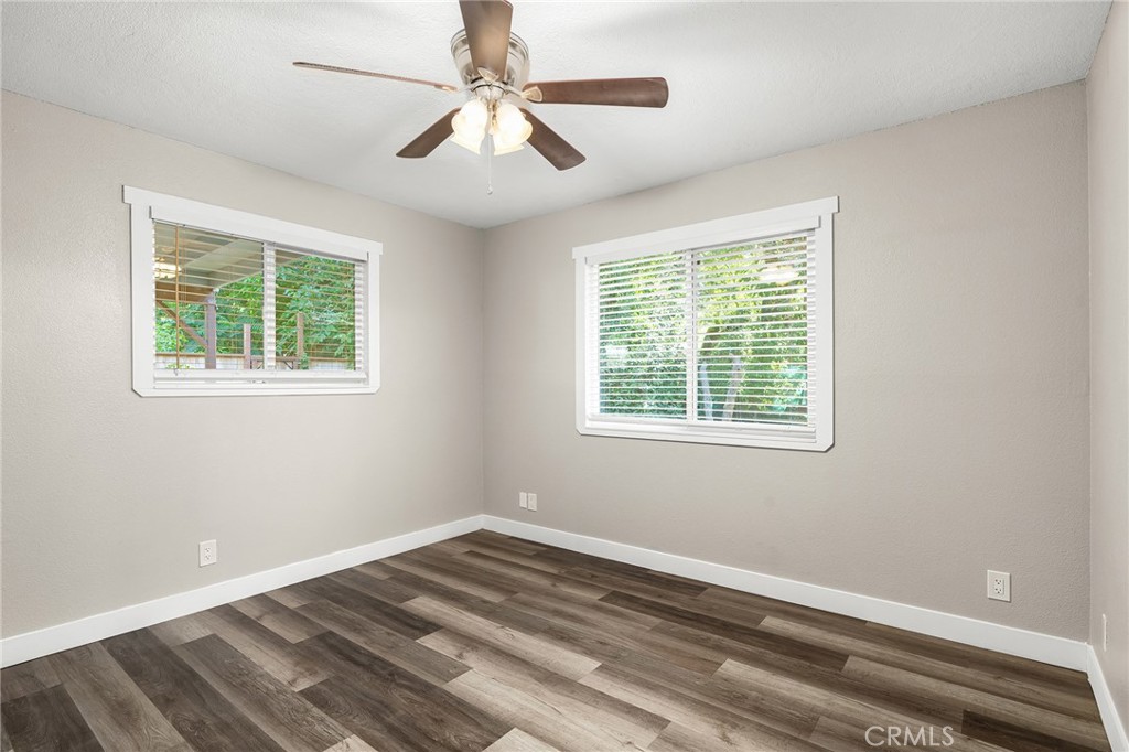 1131 Stewart Avenue Chico, CA 95926 - Photo 23 of 51 a view of an empty room with wooden floor and a window