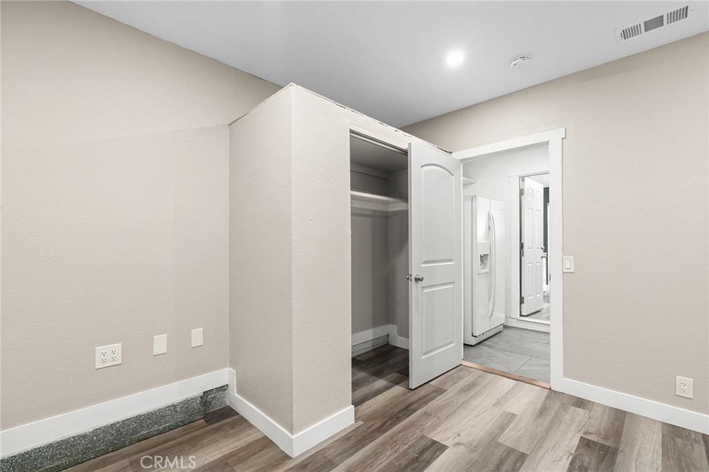 1131 Stewart Avenue Chico, CA 95926 - Photo 32 of 51 an empty room with wooden floor and entrance