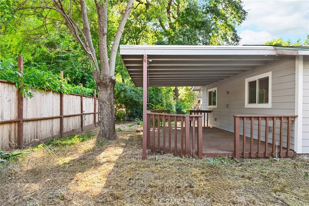 1131 Stewart Avenue Chico, CA 95926 - Photo 39 of 51 a view of a house with a small yard and wooden fence