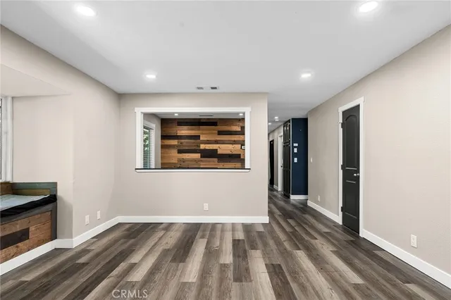 a view of room with window and hardwood floor