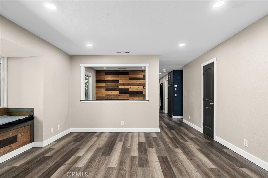 1131 Stewart Avenue Chico, CA 95926 - Photo 9 of 51 a view of an empty room with wooden floor
